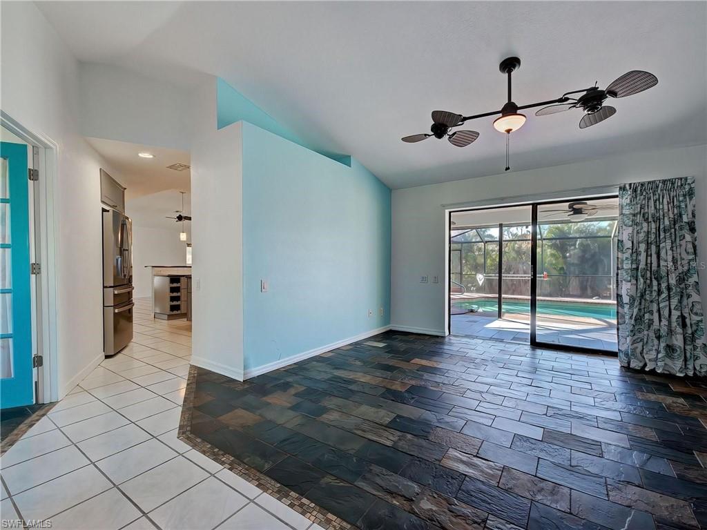 Spare room with a sunroom, ceiling fan, and lofted ceiling