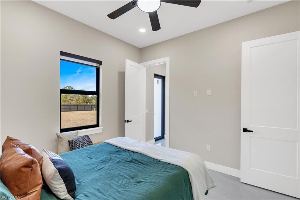 Bedroom featuring ceiling fan, recessed lighting, and light tile patterned floors