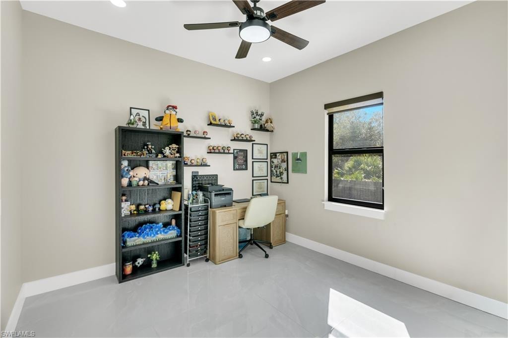 Office space with ceiling fan and recessed lighting