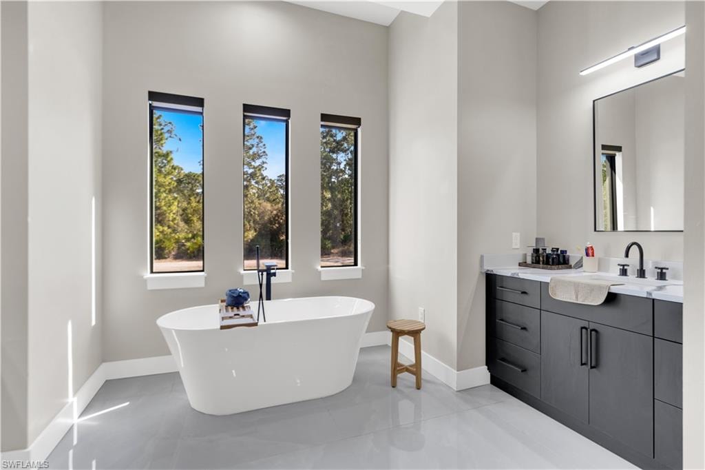 Bathroom featuring a freestanding bath and vanity