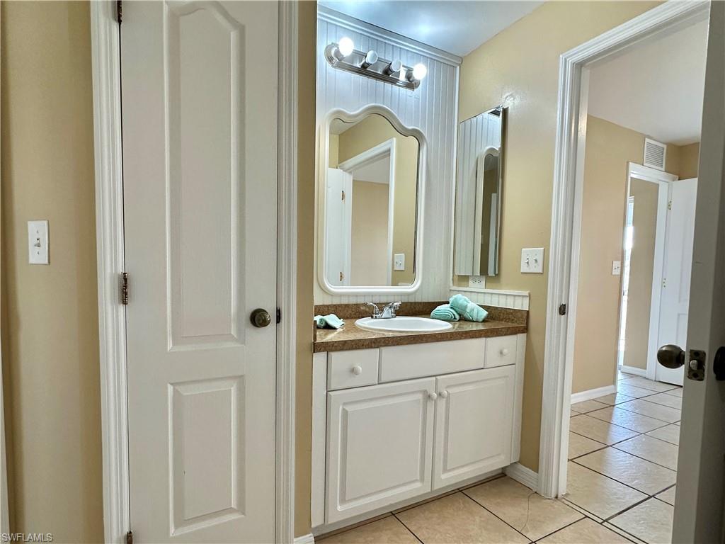 Second Jack 'n Jill Bath with Utility Closet, Mirrored Vanity and Paneled Back