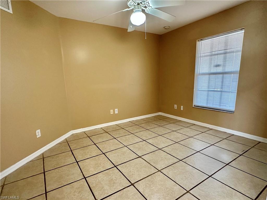 View of Grand Den with Window to Front Porch