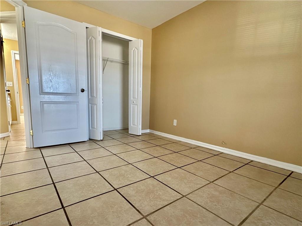 Third Front Bedroom with Bifold Closet and Doorway Into Bath/Greatroom