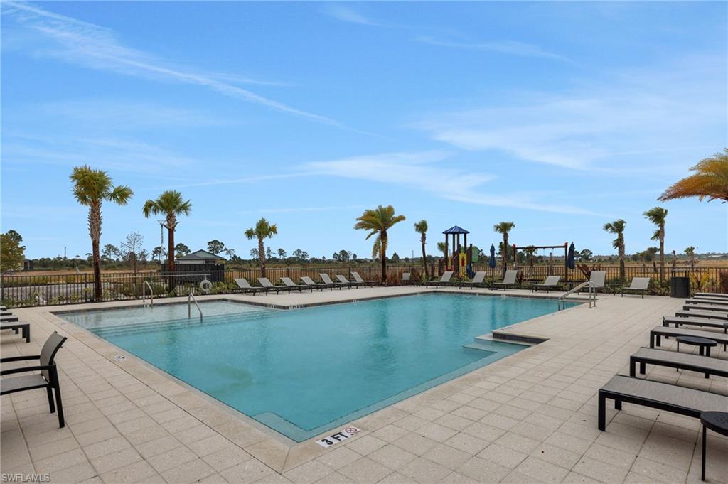 Community pool with a patio area
