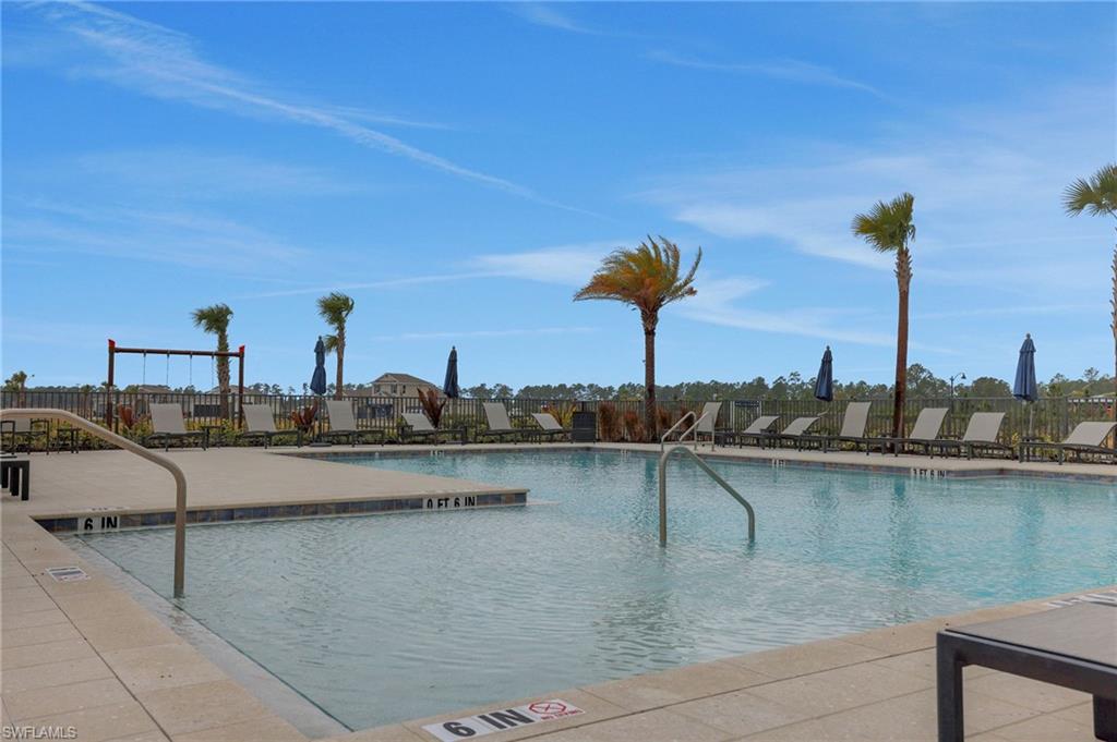 Community pool featuring a patio area