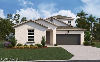 View of front of house with a front lawn, concrete driveway, stucco siding, and an attached garage