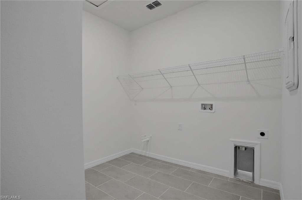 Laundry area with hookup for a washing machine and electric dryer hookup