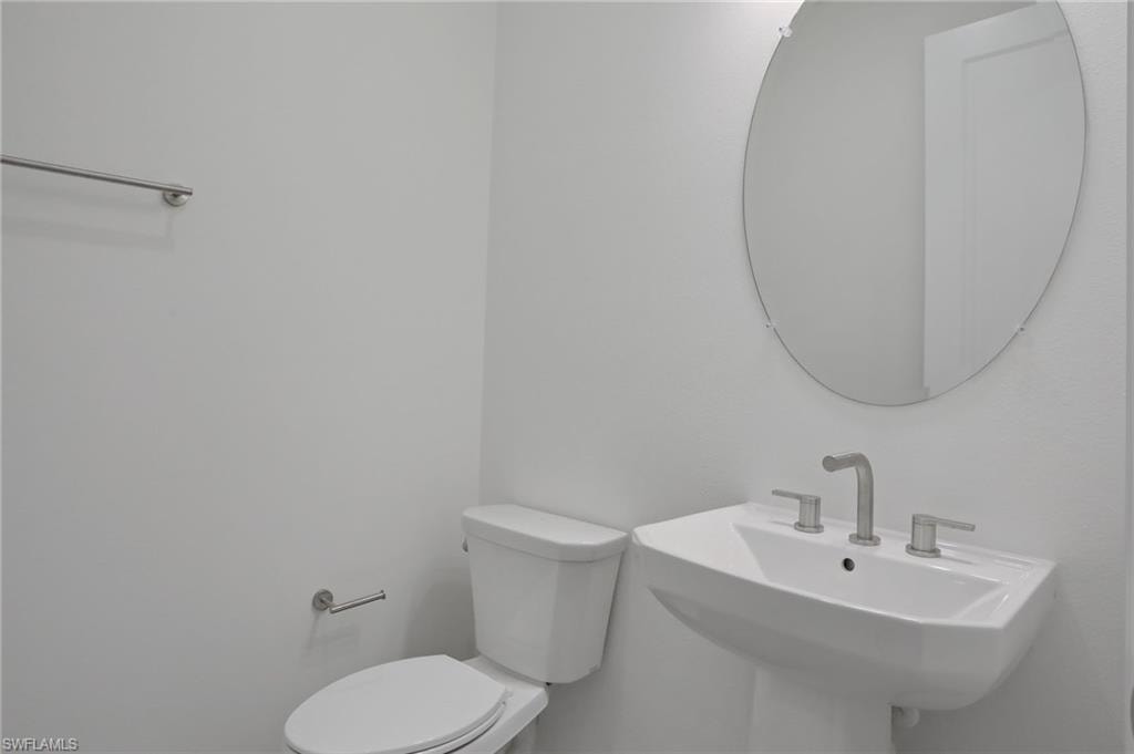 Bathroom with toilet and a sink