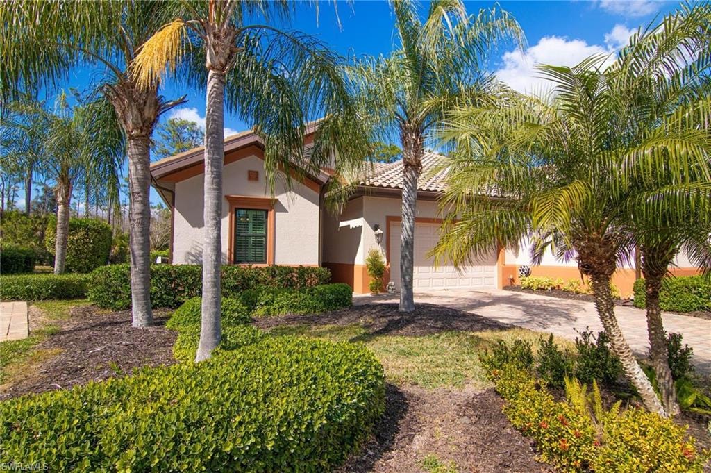 Mediterranean / spanish-style house featuring driveway, stucco siding, and a garage