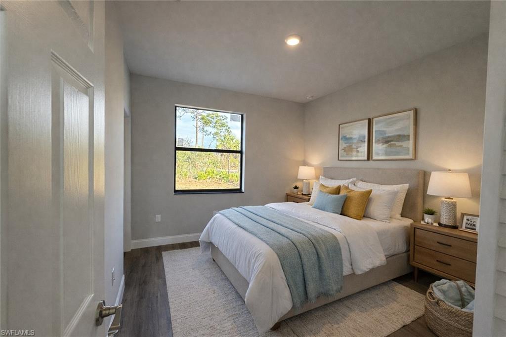 Bedroom featuring wood finished floors and recessed lighting