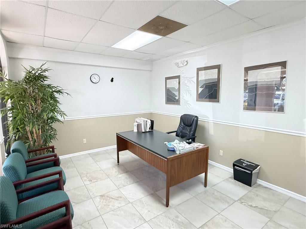 Office reception area featuring chair rail and base molding