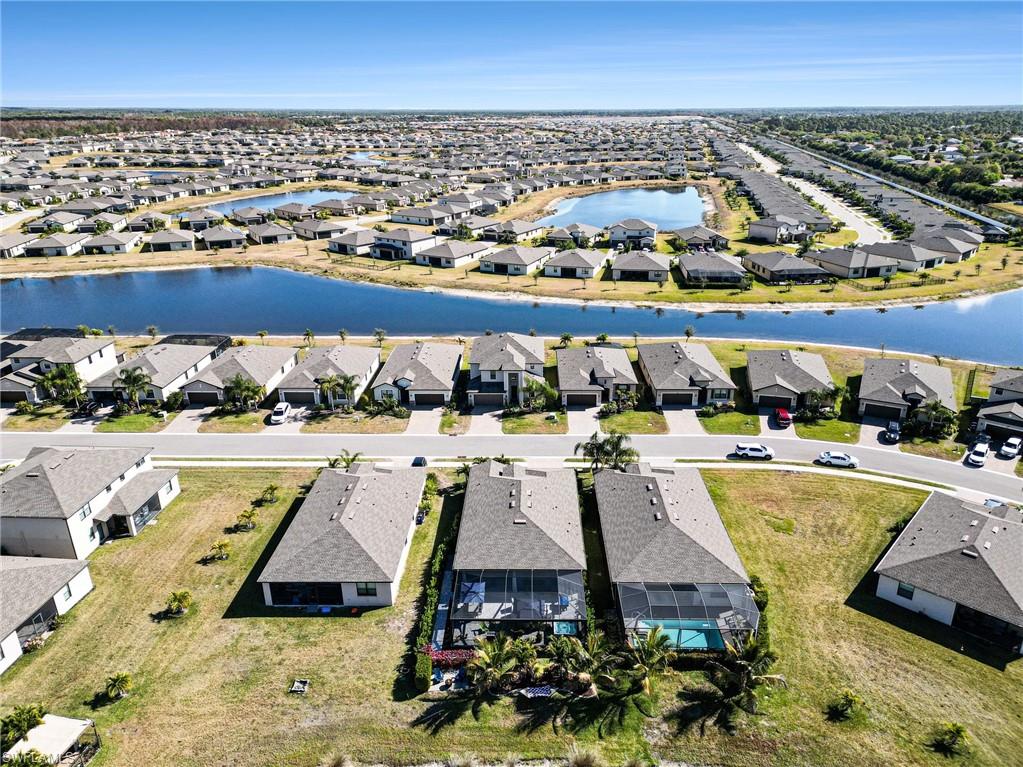 View of property location with nearby suburban area and a large body of water