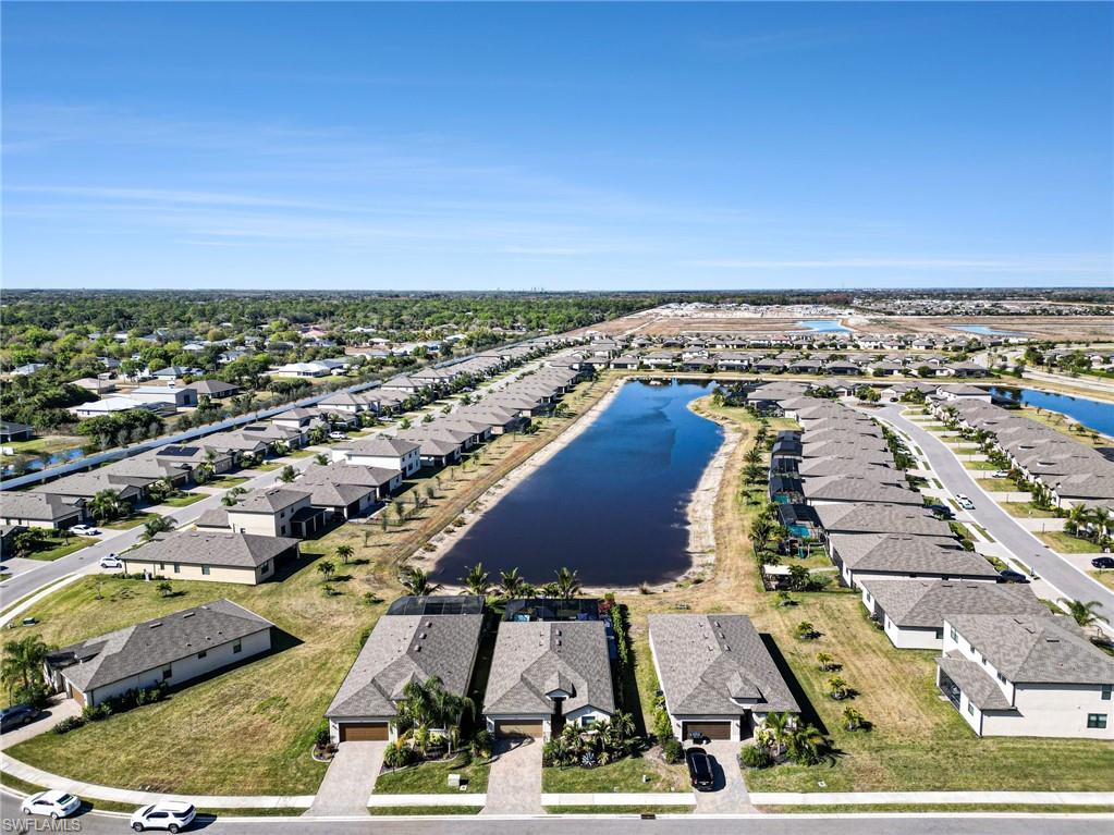 Aerial perspective of suburban area with a large body of water