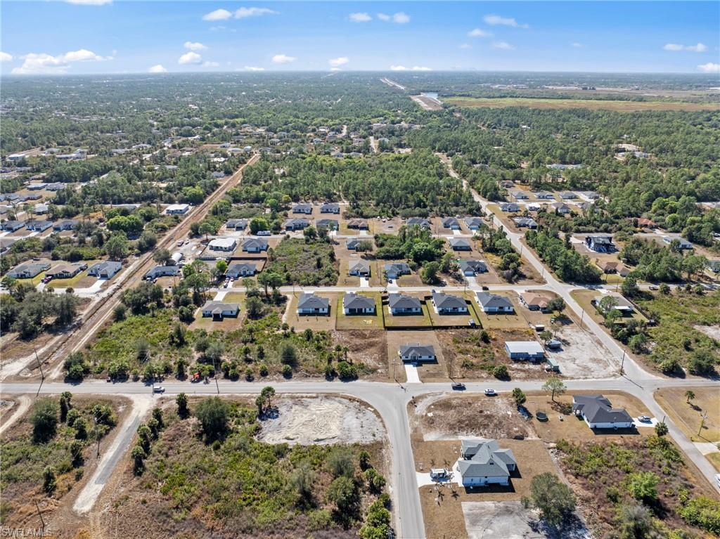 Aerial overview of property's location featuring nearby suburban area