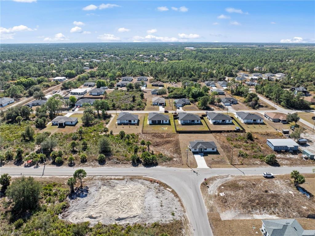 View of property location with nearby suburban area