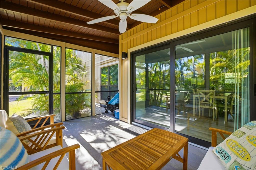 Sunroom / solarium featuring a wooden ceiling with exposed beams