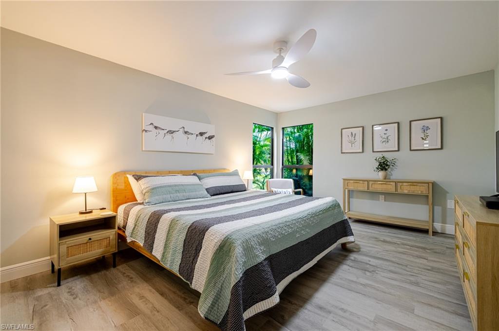 Primary Bedroom with light wood-style flooring and a ceiling fan