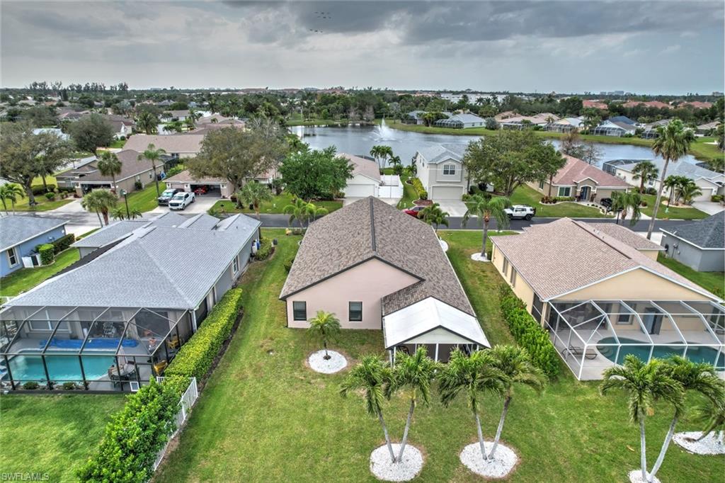 Aerial perspective of suburban area with a nearby body of water