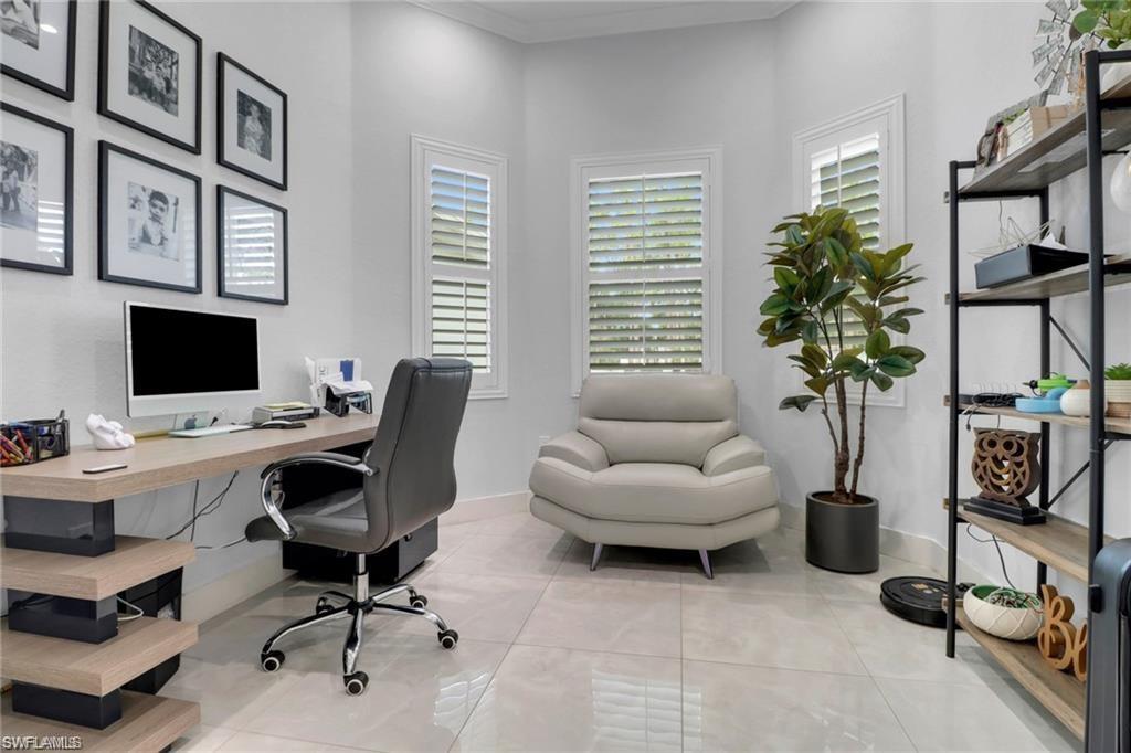 Office featuring baseboards and light tile patterned flooring