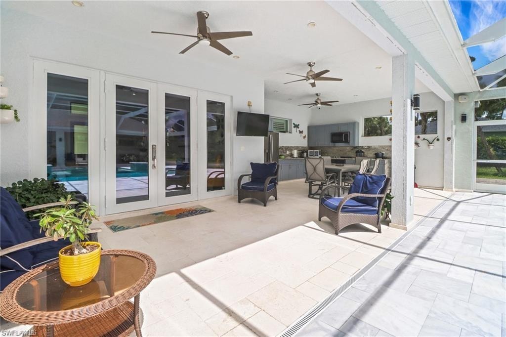 View of patio / terrace with french doors, a ceiling fan, and area for grilling