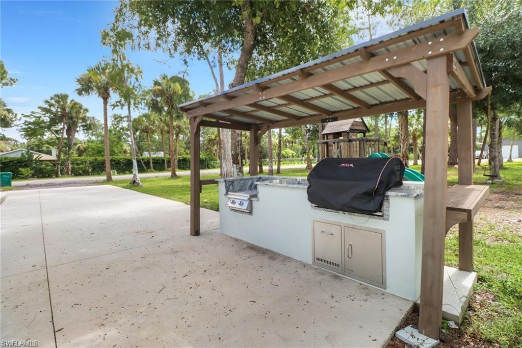 View of community with an outdoor kitchen