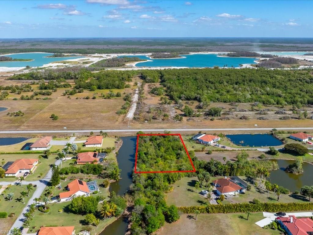 View of property location with a large body of water and property boundaries highlighted