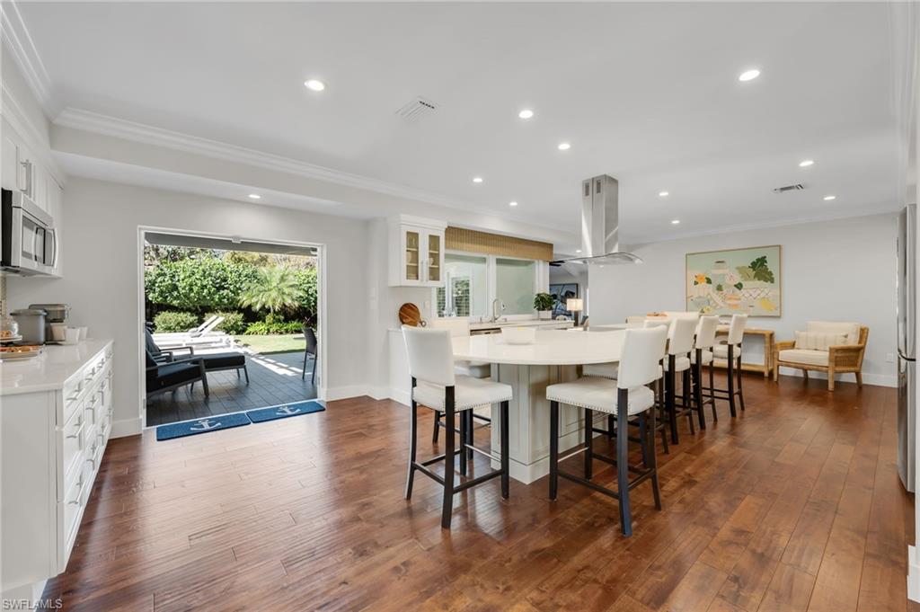 Counter height kitchen island seats eight comfortably.