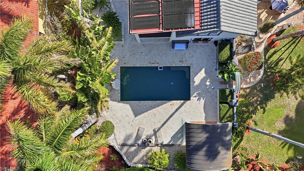 Aerial view of property and surrounding area with a pool area