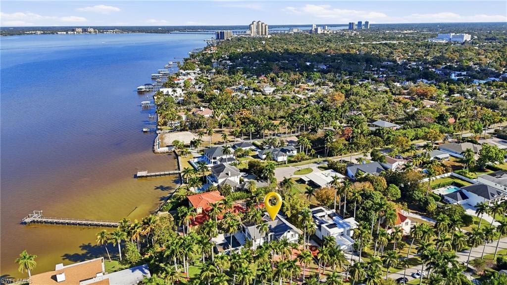 Aerial perspective of suburban area with a large body of water