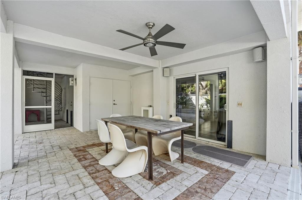 Dining area featuring ceiling fan and stairway