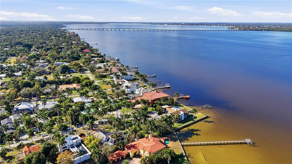 Aerial view of residential area featuring a notable bridge and a nearby body of water