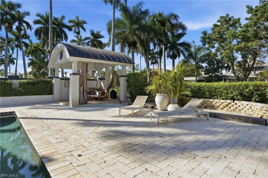 View of community with a patio and a pool