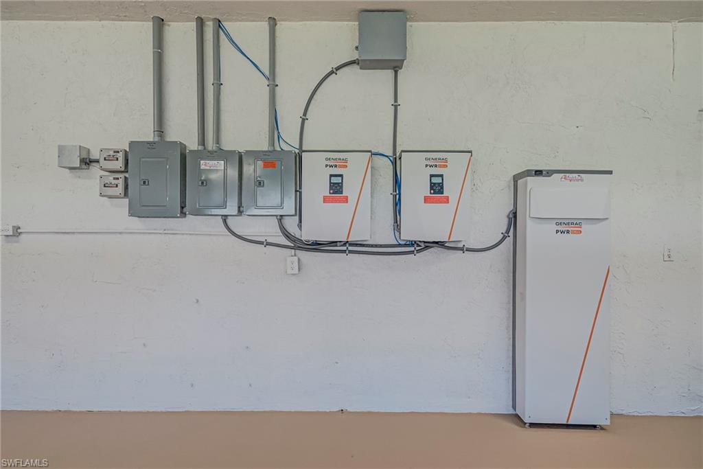 Utilities featuring solar system panel in the garage