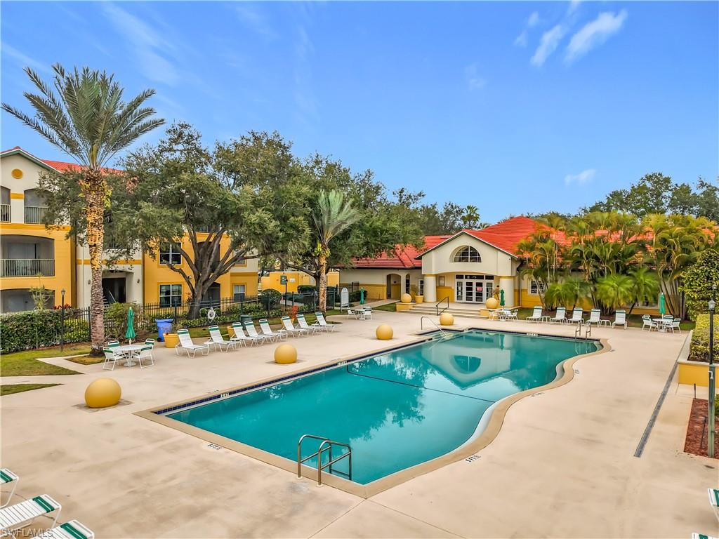 Community pool with a patio