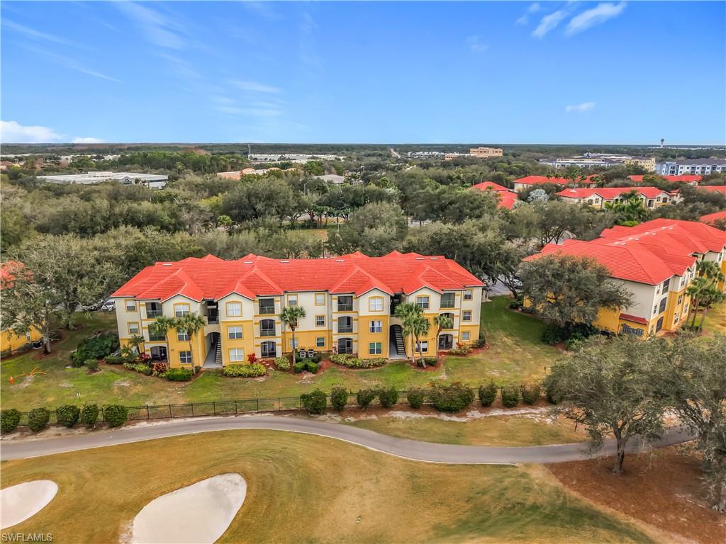 Bird's eye view of apartment complex and a golf course