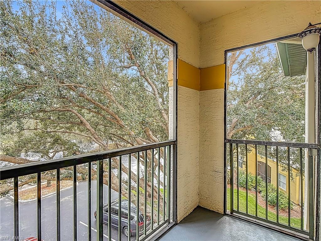 Balcony featuring a sunroom
