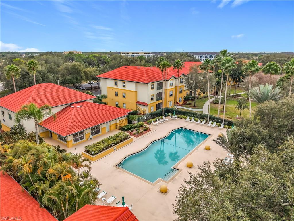 Community pool with a patio