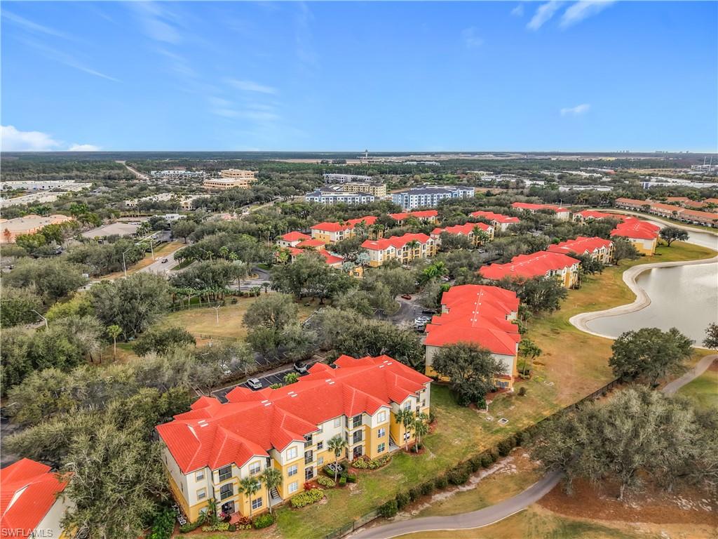 Aerial view of property's location featuring apartment complex and a large body of water