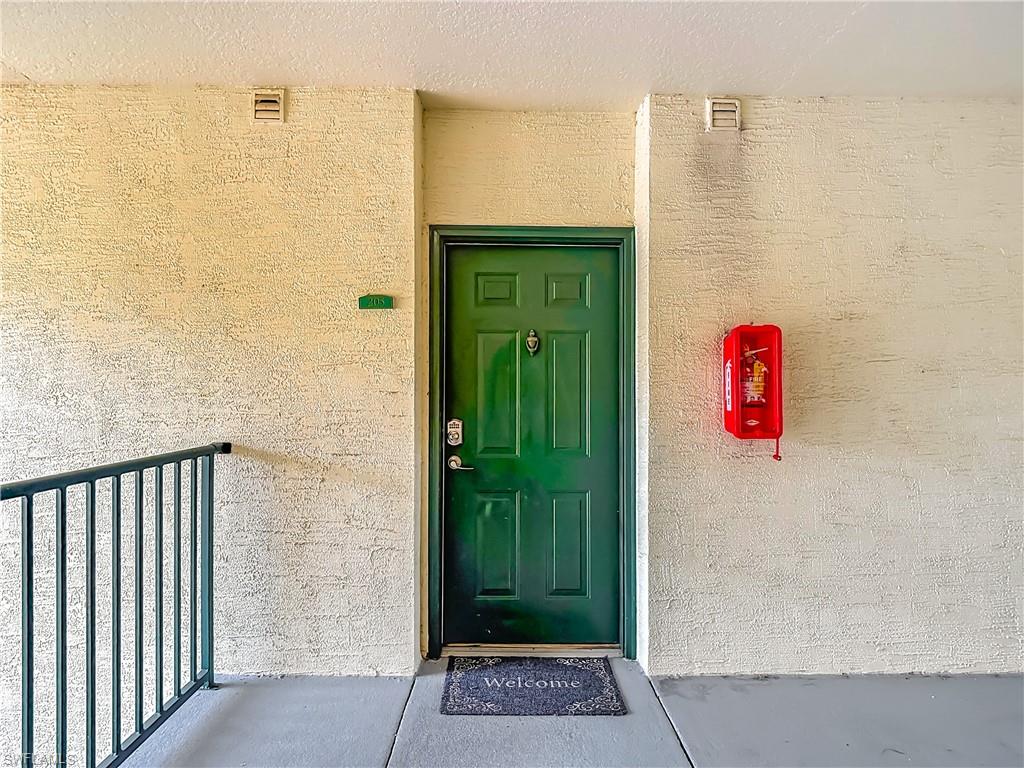 View of exterior entry with stucco siding