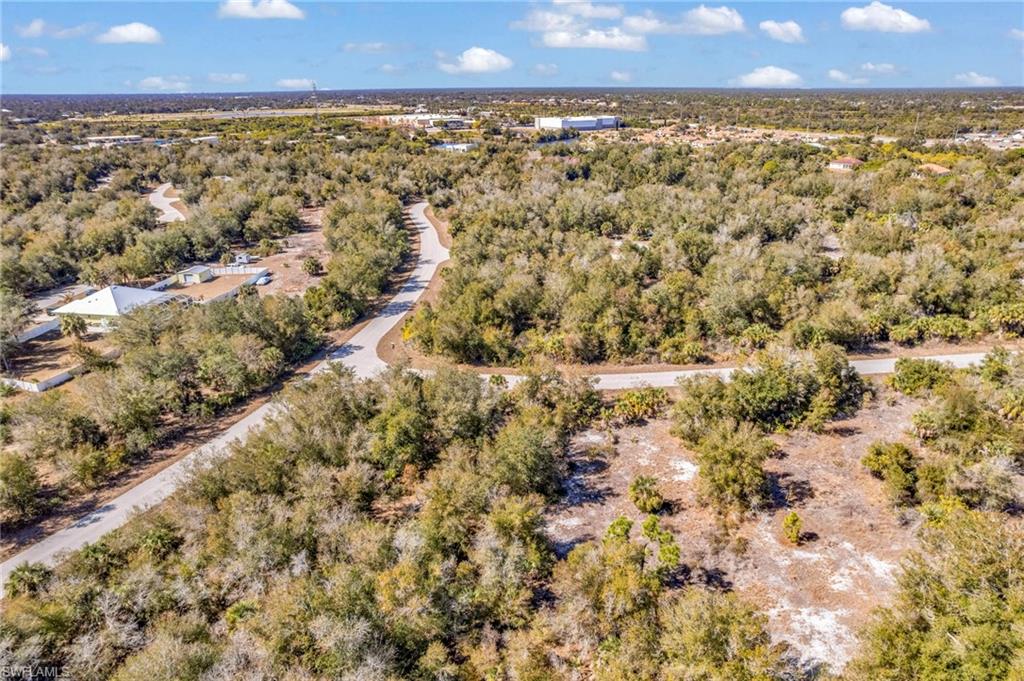 Aerial overview of property's location featuring a forest