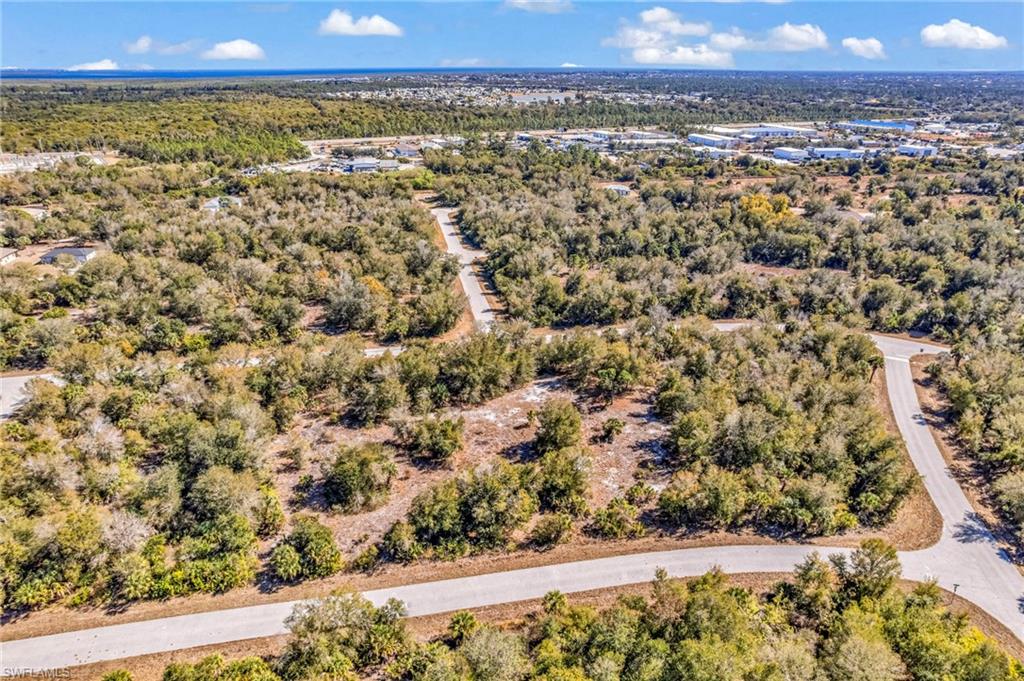 View of property location featuring a forest