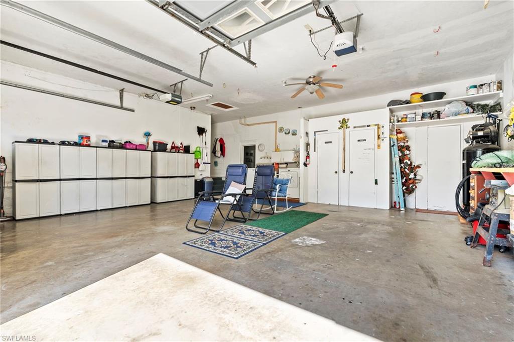 Garage featuring a garage door opener