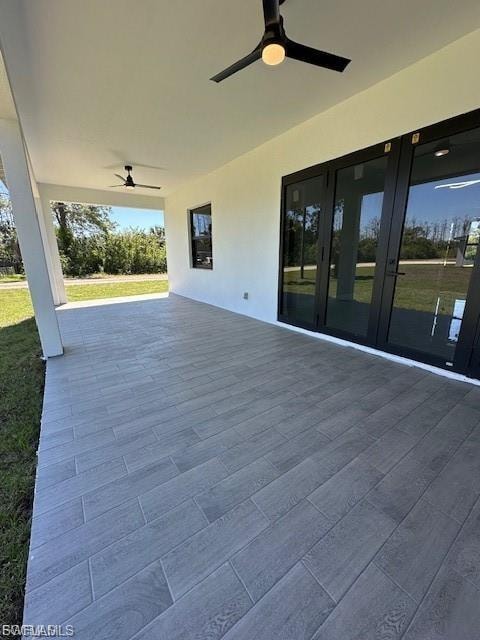 View of patio with ceiling fan and french doors
