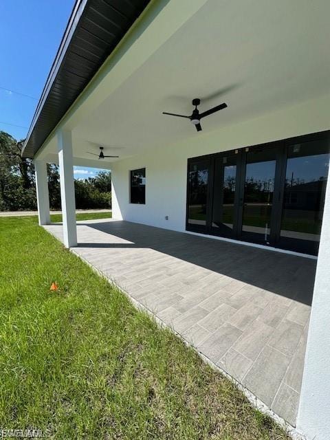View of patio featuring ceiling fan and french doors