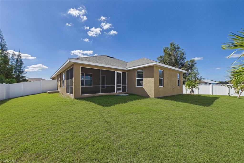 6 ft fence surrounds yard. Room to add pool or just enjoy.