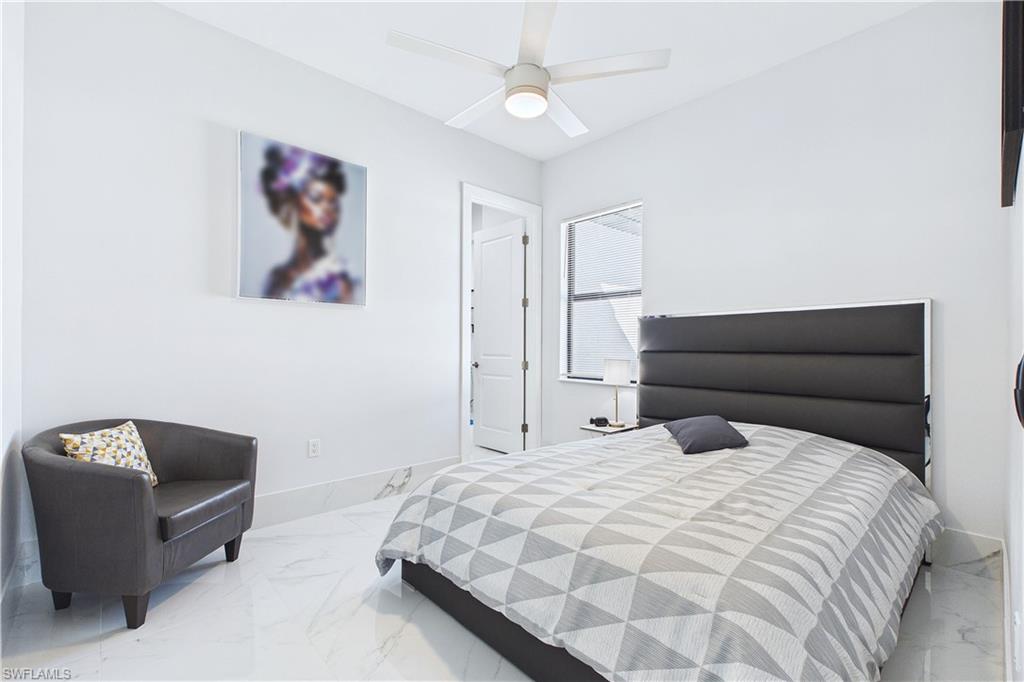 Bedroom with baseboards and a ceiling fan