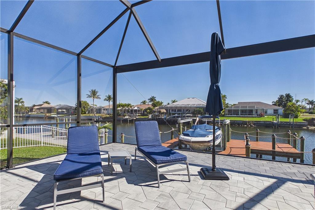 View of patio featuring a boat dock, a residential view, and a water view