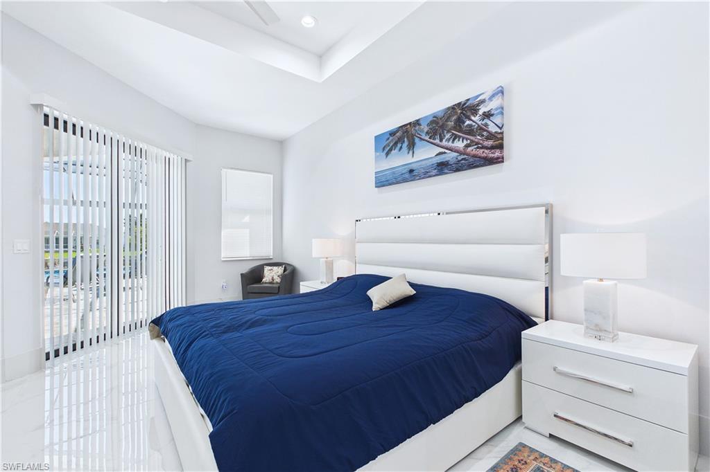 Bedroom featuring access to exterior and recessed lighting