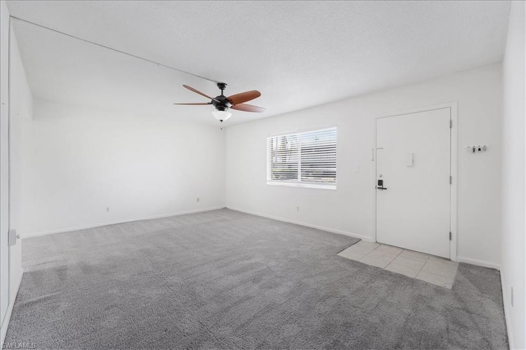 Unfurnished bedroom with carpet flooring, a ceiling fan, and a closet