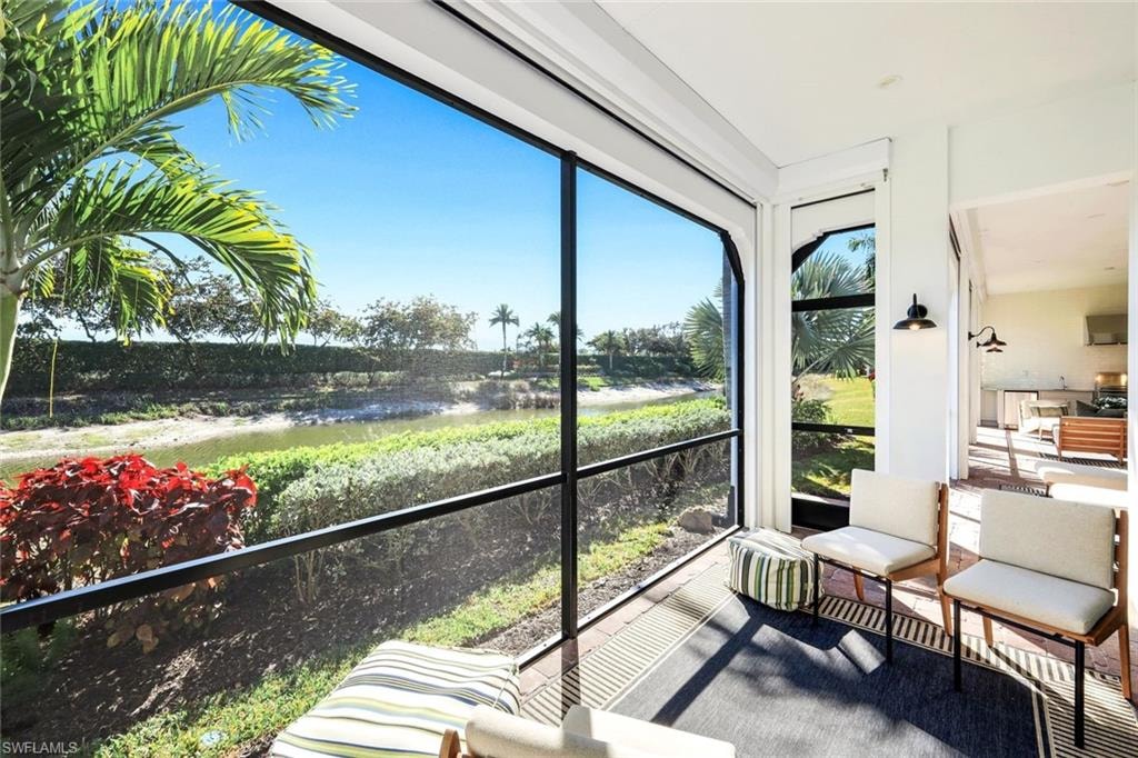 Sunroom with a water view